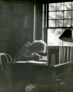 student revising with notes and flashcards at a desk