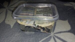 piggy bank surrounded by coins