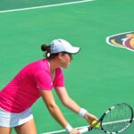 A tennis player ready at the net during a match