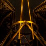 telescope pointed at a star-filled night sky