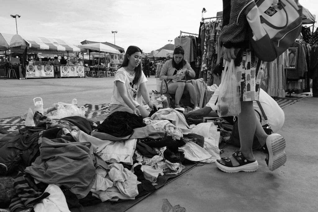 Garments in natural fabrics hanging on a clothing rack