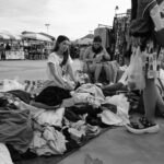 Garments in natural fabrics hanging on a clothing rack